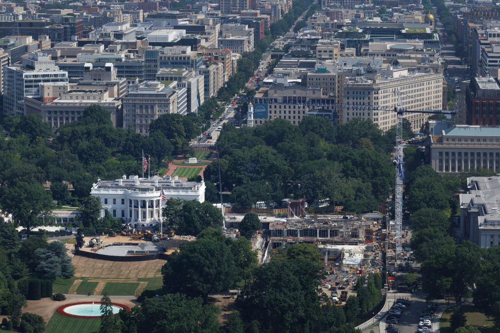 Workers construct a helipad for Marine One on the South Lawn of the White House, Wednesday, July 1, 2026, in Washington. (AP Photo/Tom Brenner)