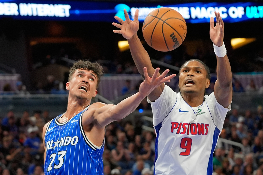 Orlando Magic forward Tristan da Silva (23) and Detroit Pistons guard Ausar Thompson (9) go after a rebound during the first half of an NBA basketball game, Sunday, March 1, 2026, in Orlando, Fla. (AP Photo/John Raoux)