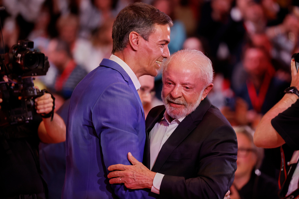 Spain's Prime Minister Pedro Sanchez, left, embraces Brazil's President Luiz Inacio Lula da Silva at the end of the Global Progressive Mobilisation summit in Barcelona, Spain, Saturday, April 18, 2026. (AP Photo/Joan Monfort)