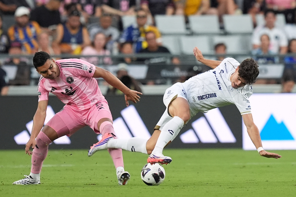 Inter Miami midfielder Casemiro (5) battles with Atletico de San Luis forward Rafa Llorente, right, during the first half of a Leagues Cup soccer match, Wednesday, Aug. 5, 2026, in Miami. (AP Photo/Rebecca Blackwell)