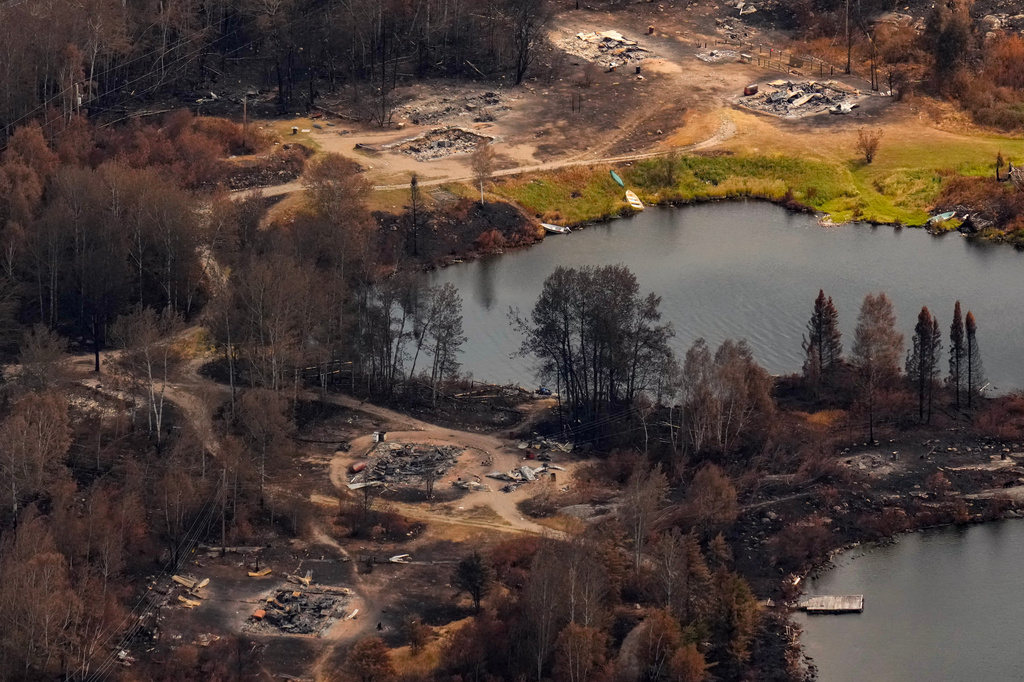 FILE - Debris from wildfire damage is visible at Collins First Nation in northwestern Ontario, Canada, July 22, 2026. (Chris Young/The Canadian Press via AP, File)