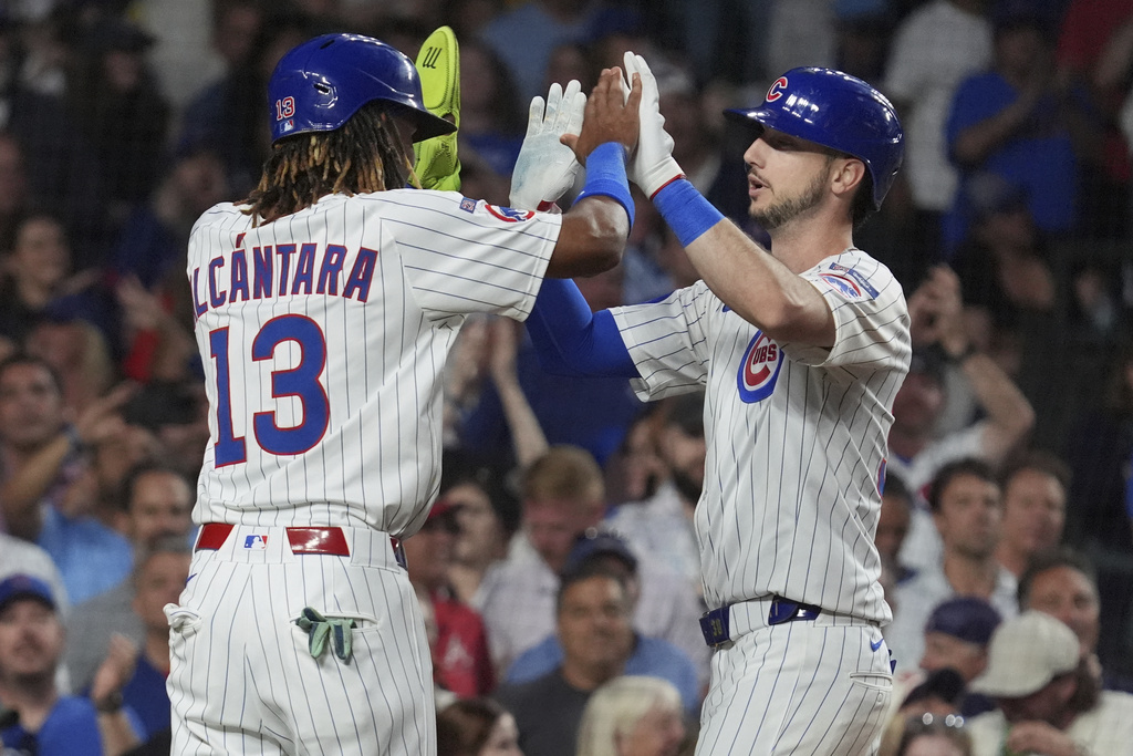 Chicago Cubs' Kyle Tucker, right, celebrates with Kevin Alcántara after hitting a three-run home run during the third inning of a baseball game against the Atlanta Braves in Chicago, Tuesday, Sept. 2, 2025. (AP Photo/Nam Y. Huh)
