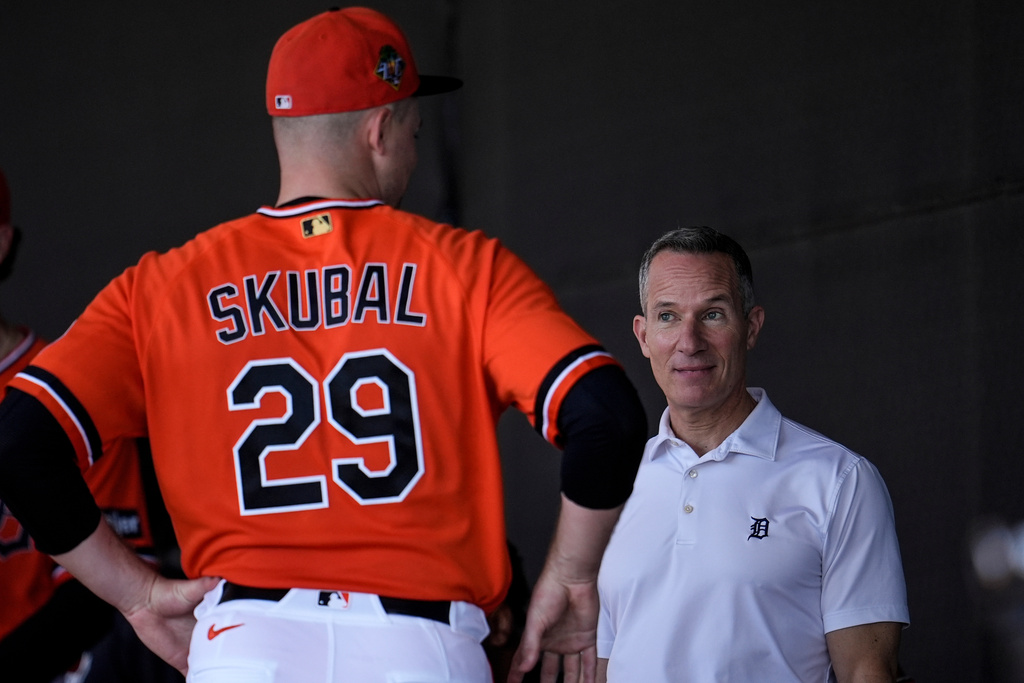 Detroit Tigers owner Chris Ilitch speaks with Detroit Tigers pitcher Tarik Skubal during workouts at spring training baseball, Friday, Feb. 20, 2026, in Lakeland. (AP Photo/Mike Stewart)
