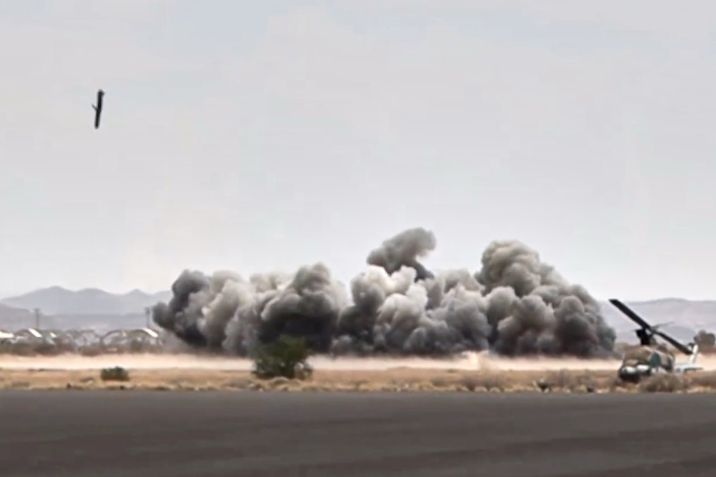 This image taken from video broadcast by Al-Masirah TV, a Houthi-controlled news channel, shows a projectile striking the Sanaa International Airport compound during what the Iranian-backed Houthi rebels in Yemen said were several Saudi airstrikes in Sanaa, Yemen, Monday, July 13, 2026. (Al-Masirah TV via AP)
