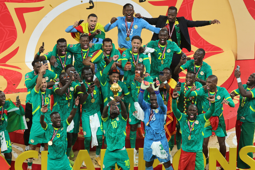 Senegal's Sadio Mane holds the trophy aloft as he celebrates with teammates after winning the Africa Cup of Nations final soccer match between Senegal and Morocco in Rabat, Morocco, Sunday, Jan. 18, 2026. (AP Photo/Youssef Loulidi)