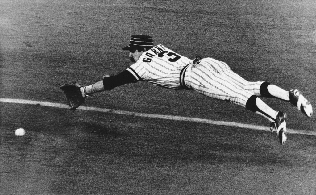 FILE - Pirates Phil Garner dives for ball hit by Al Bumbry of Baltimore Orioles in fifth inning of third game of World Series, Oct. 12, 1979 in Pittsburgh. (AP Photo, File)