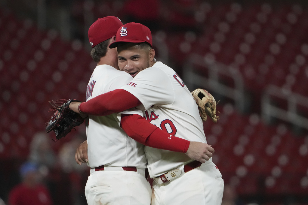 St. Louis Cardinals' Willson Contreras, right, celebrates a victory over the Athletics with teammate Nolan Gorman following a baseball game Wednesday, Sept. 3, 2025, in St. Louis. (AP Photo/Jeff Roberson)