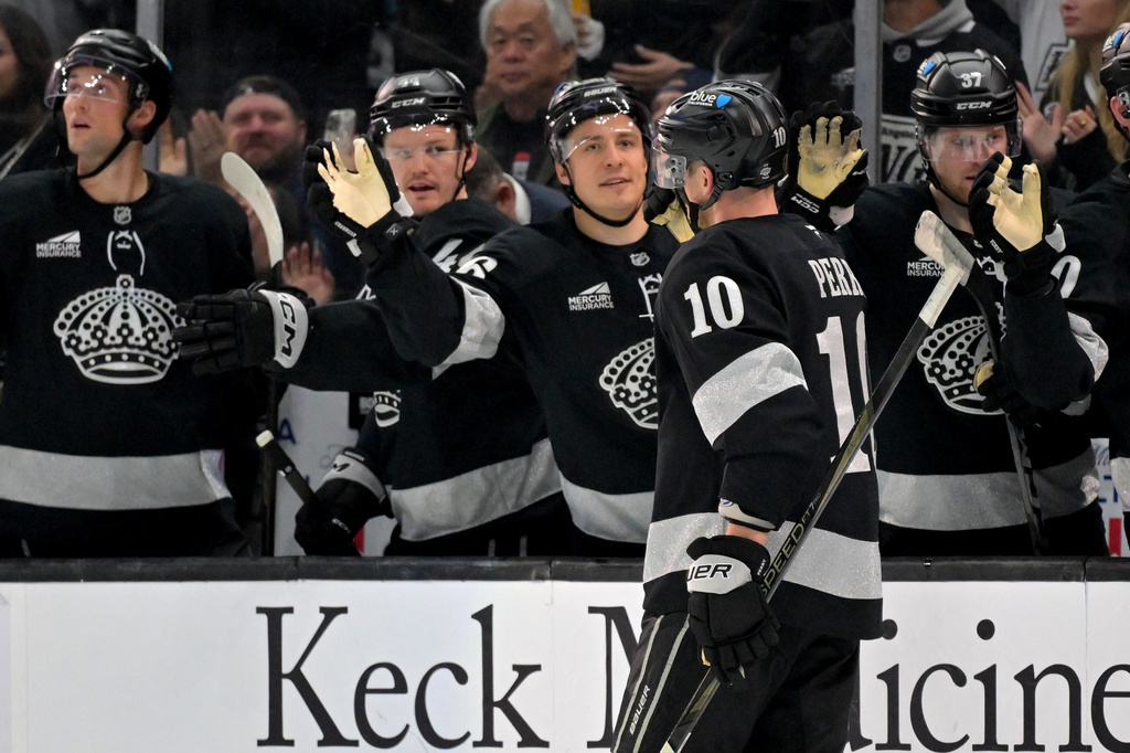 Los Angeles Kings right wing Corey Perry (10) is congratulated at the bench after scoring during the second period of an NHL hockey game against the Minnesota Wild, Saturday, Jan. 3, 2026, in Los Angeles. (AP Photo/Jayne Kamin-Oncea)