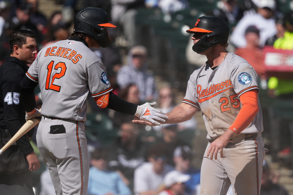 Baltimore Orioles' Pete Alonso, right, celebrates with Dylan Beavers after scoring on a passed ball by Chicago White Sox catcher Reese McGuire during the sixth inning of a baseball game in Chicago, Wednesday, April 8, 2026. (AP Photo/Nam Y. Huh)