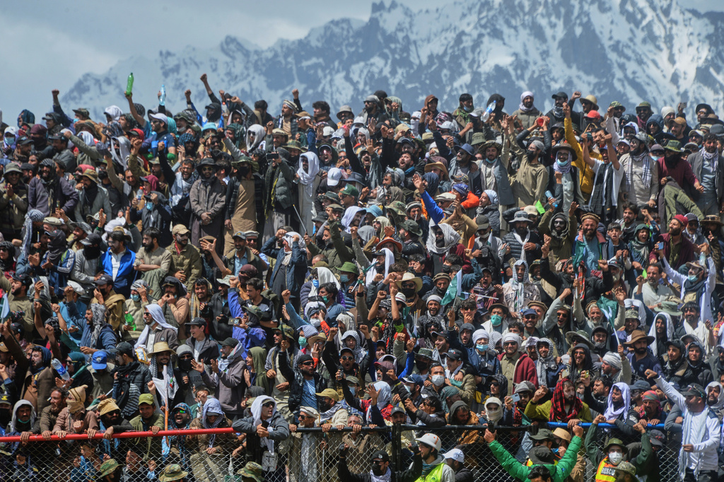 Spectators cheer during the final match of the three-day annual Shandur Polo Festival in Shandur Pass, in the Ghizer district of Gilgit-Baltistan, northern Pakistan, Saturday, June 13, 2026. (AP Photo/Zubair Abbasi)