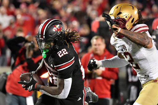 Louisville running back Keyjuan Brown (22) outruns the grasp of Boston College defensive back KP Price (2) during the second half of an NCAA college football game in Louisville, Ky., Saturday, Oct. 25, 2025. (AP Photo/Timothy D. Easley) Louisville running back Keyjuan Brown (22) outruns the grasp of Boston College defensive back KP Price (2) during the second half of an NCAA college football game in Louisville, Ky., Saturday, Oct. 25, 2025. (AP Photo/Timothy D. Easley)