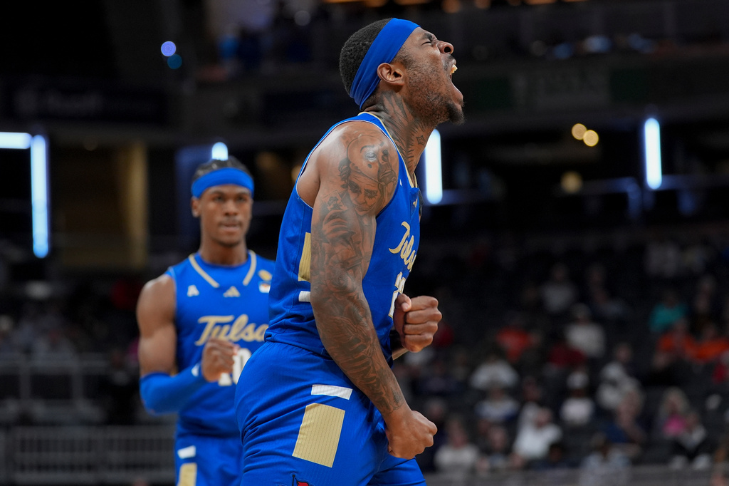 Tulsa forward David Green celebrates a basket against Auburn during the second half of the NCAA college basketball NIT Championship game, Sunday, April 5, 2026, in Indianapolis. (AP Photo/Abbie Parr)