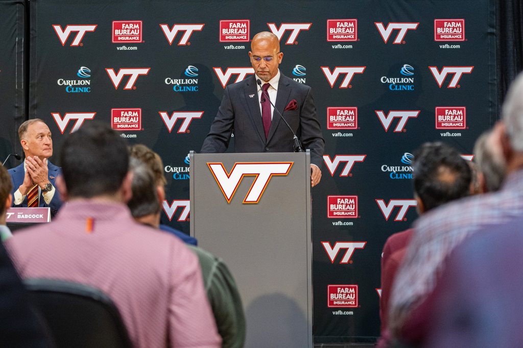 James Franklin, Virginia Tech's new head football coach, pauses after he was introduced during an NCAA college football news conference, Wednesday, Nov. 19, 2025, in Blacksburg, Va. (AP Photo/Robert Simmons)