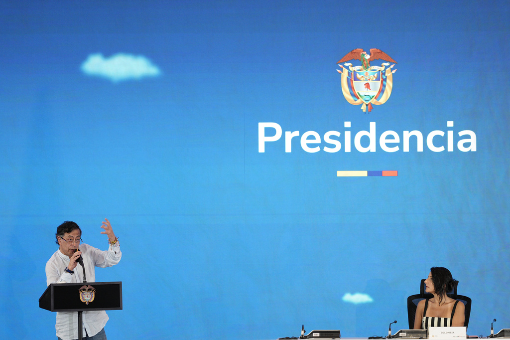 President Gustavo Petro, of Colombia, speaks as Colombia's Environment Minister Irene Vélez Torres, right, listens, during a conference aimed at transitioning away from fossil fuels Tuesday, April 28, 2026, in Santa Marta, Colombia. (AP Photo/Ivan Valencia)