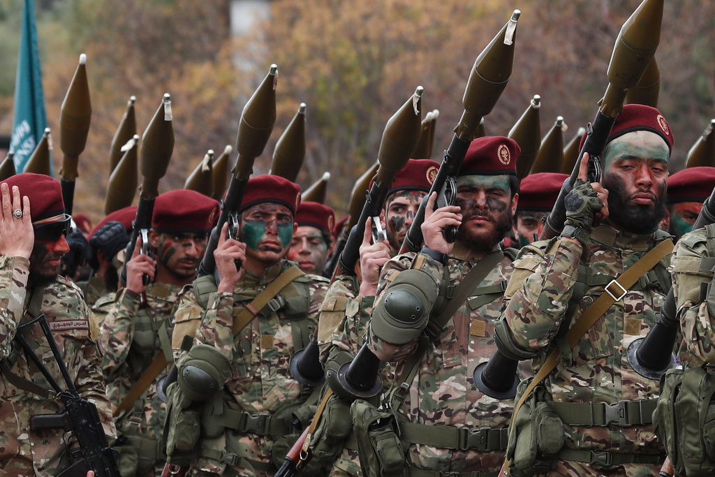 Fighters from the new Syrian army march with rocket-propelled grenade launchers during a parade marking the first anniversary of the ousting of former President Bashar Assad in Damascus, Syria, Monday, Dec. 8, 2025. (AP Photo/Omar Sanadiki)