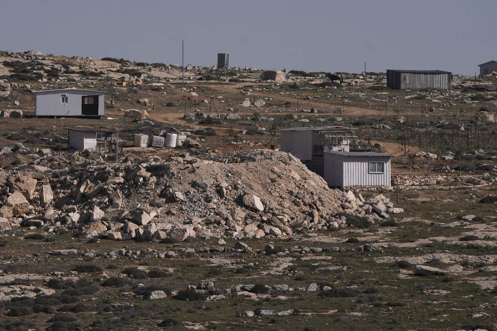 An Israeli settlers outpost is seen on area next to the town of As Samu', near the West Bank city of Hebron, Tuesday, Dec. 23, 2025. (AP Photo/Mahmoud Illean)