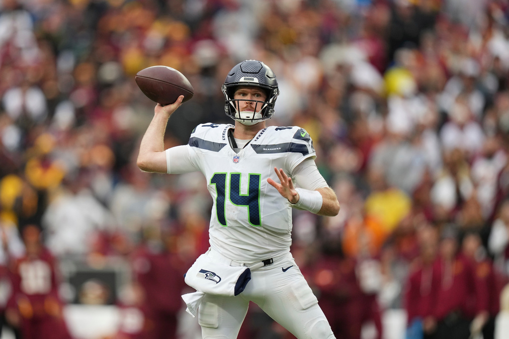 Seattle Seahawks quarterback Sam Darnold (14) throws the ball during the second half of an NFL football game against Washington Commanders, Sunday, Sept. 27, 2026 in Landover, Md. (AP Photo/Stephanie Scarbrough)