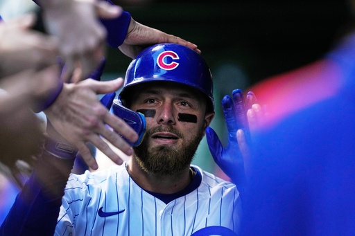 Chicago Cubs' Michael Busch celebrates after hitting a home run during the first inning of Game 3 of baseball's National League Division Series against the Milwaukee Brewers Wednesday, Oct. 8, 2025, in Chicago. (AP Photo/Erin Hooley) Chicago Cubs' Michael Busch celebrates after hitting a home run during the first inning of Game 3 of baseball's National League Division Series against the Milwaukee Brewers Wednesday, Oct. 8, 2025, in Chicago. (AP Photo/Erin Hooley)