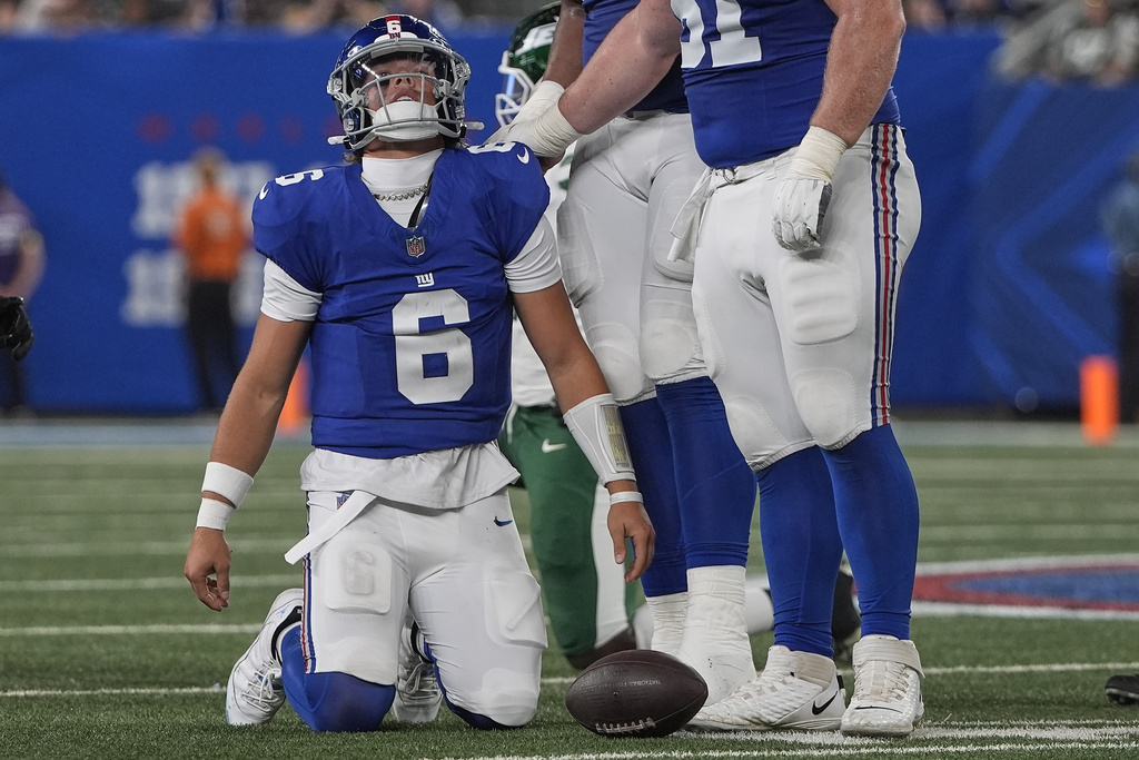 New York Giants quarterback Jaxson Dart (6) reacts after being sacked by the New York Jets during the second quarter of an NFL football game, Saturday, Aug. 16, 2025, in East Rutherford, N.J. (AP Photo/Pamela Smith)