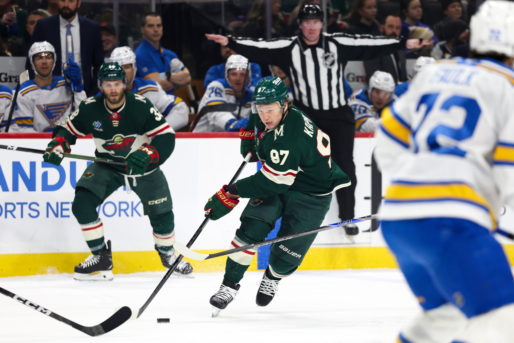 Minnesota Wild left wing Kirill Kaprizov (97) takes the puck upice against the St. Louis Blues during the first period of an NHL hockey game Sunday, March 1, 2026, in St. Paul, Minn. (AP Photo/Ellen Schmidt)