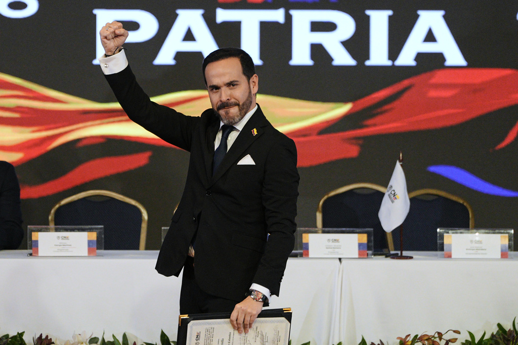 Colombian President-elect Abelardo de la Espriella raise his fist after receiving his credentials from the National Electoral Council in Bogota, Colombia, Thursday, June 25, 2026. (AP Photo/Ivan Valencia)
