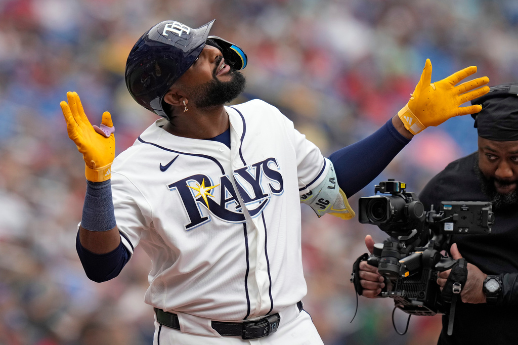Tampa Bay Rays' Junior Caminero celebrates his solo home run off Cincinnati Reds pitcher Brandon Williamson during the third inning of a baseball game Wednesday, April 22, 2026, in St. Petersburg, Fla. (AP Photo/Chris O'Meara)