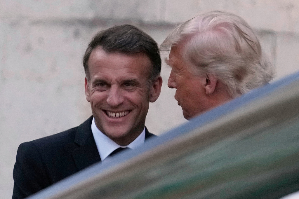 France's President Emmanuel Macron, left, greets U.S. President Donald Trump before a private dinner to celebrate the USA's 250th birthday, at the Palace of Versailles, outside Paris, Wednesday, June 17, 2026. (AP Photo/Michel Euler)