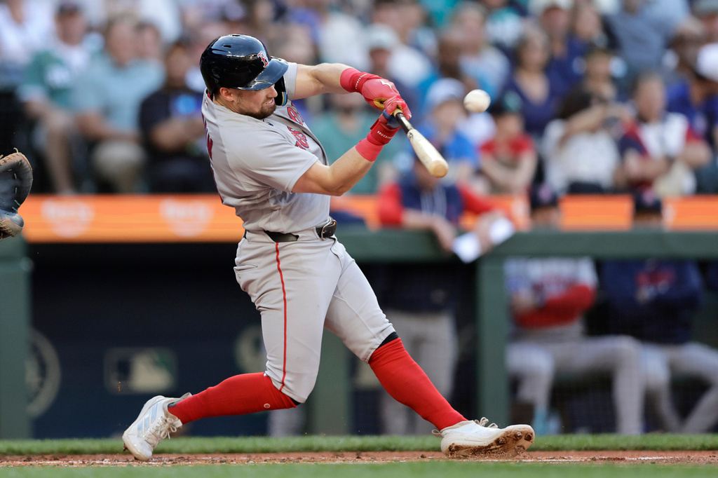 Boston Red Sox's Caleb Durbin hits a solo home run off Seattle Mariners starting pitcher Bryce Miller during the second inning of a baseball game, Friday, June 19, 2026, in Seattle. (AP Photo/John Froschauer)