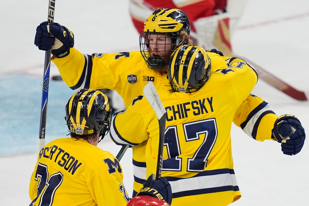 Michigan forward Josh Eernisse (6) celebrates after scoring against Denver in the first period of a semifinal game of the NCAA Frozen Four men's college hockey tournament Thursday, April 9, 2026, in Las Vegas. (AP Photo/John Locher)