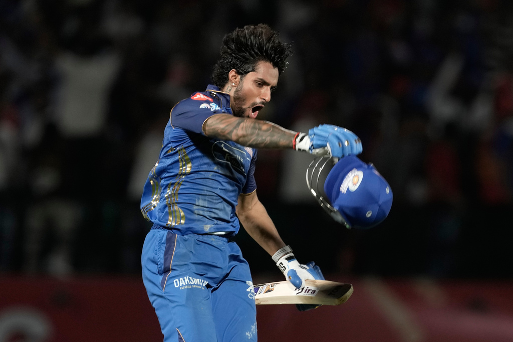 Mumbai Indians' Tilak Varma celebrates after their win in the Indian Premier League cricket match against Punjab Kings in Dharamshala, India, Thursday, May 14, 2026. (AP Photo/Ashwini Bhatia)