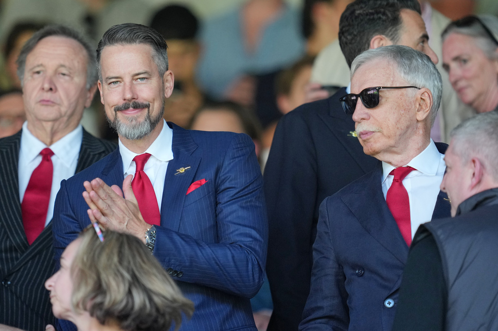 Arsenal owner Stan Kroenke, right, and his son Josh pictured in the stands ahead of the English Premier League soccer match between Crystal Palace and Arsenal in London, England, Sunday, May 24, 2026. (AP Photo/Kin Cheung)