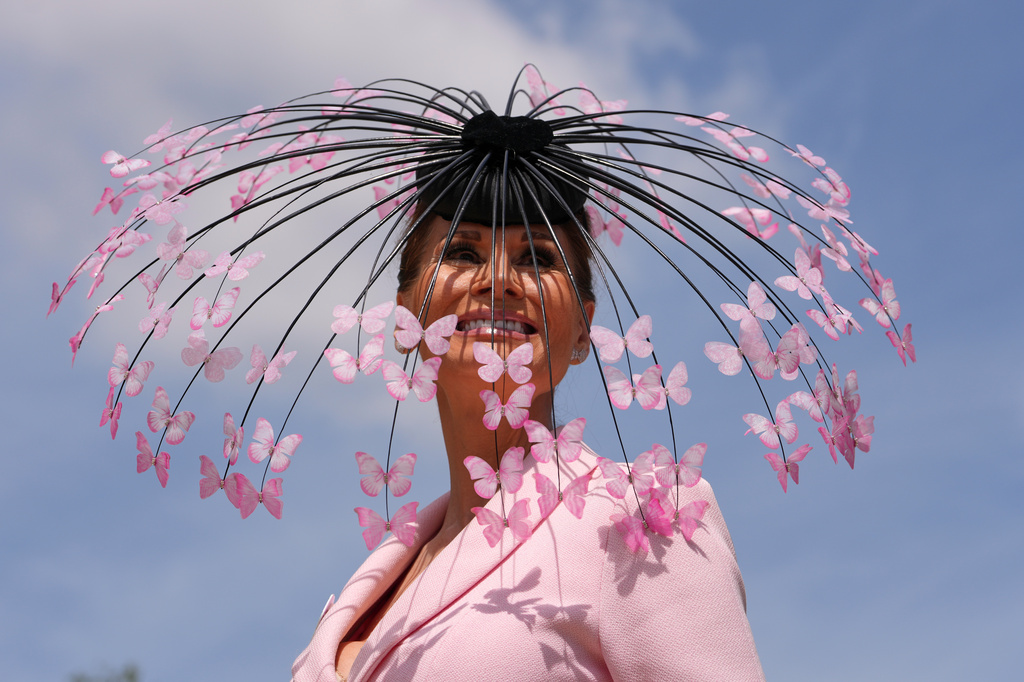 Racegoer Isabell Kristensen poses for photographers on the first day of the Royal Ascot horse race meeting in Ascot, England, Tuesday, June 16, 2026.(AP Photo/Kin Cheung)