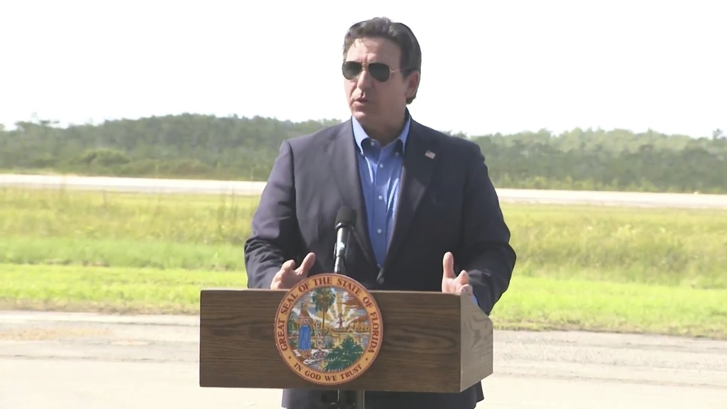 FILE - This image from a video feed shows Gov. Ron DeSantis speaking about deportation flights from the remote Everglades immigration lockup known as "Alligator Alcatraz″ on July 25, 2025 in Ochopee, Florida. (Office Of Florida Governor Ron Desantis via AP, file)