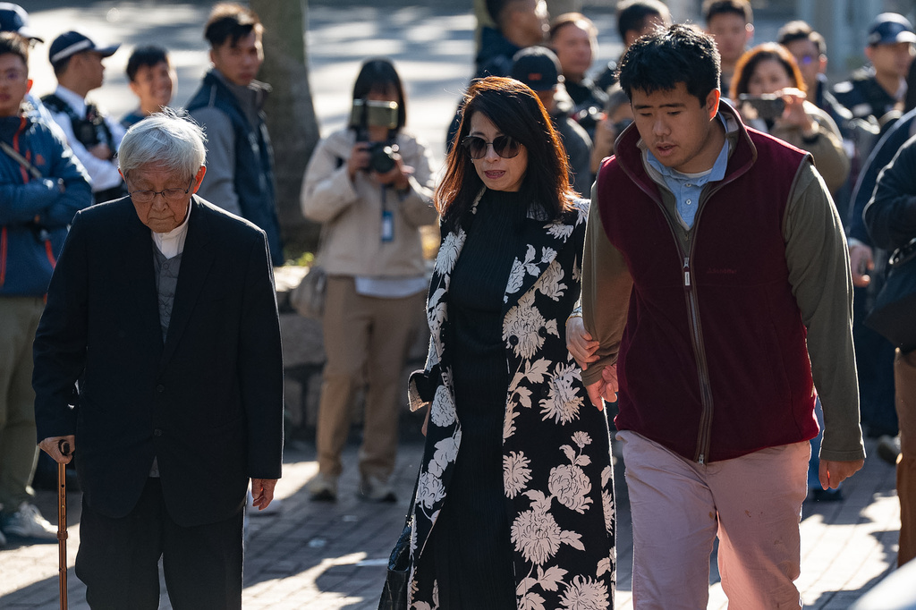 Retired Chinese cardinal Joseph Zen Ze-Kiun, from left, Jimmy Lai's wife Teresa Lai and Jimmy Lai's son Augustin Lai arrive at the West Kowloon Magistrates' Courts ahead of the verdict for Hong Kong activist publisher Jimmy Lai's national security trial in Hong Kong, Monday, Dec. 15, 2025. (AP Photo/Chan Long Hei)