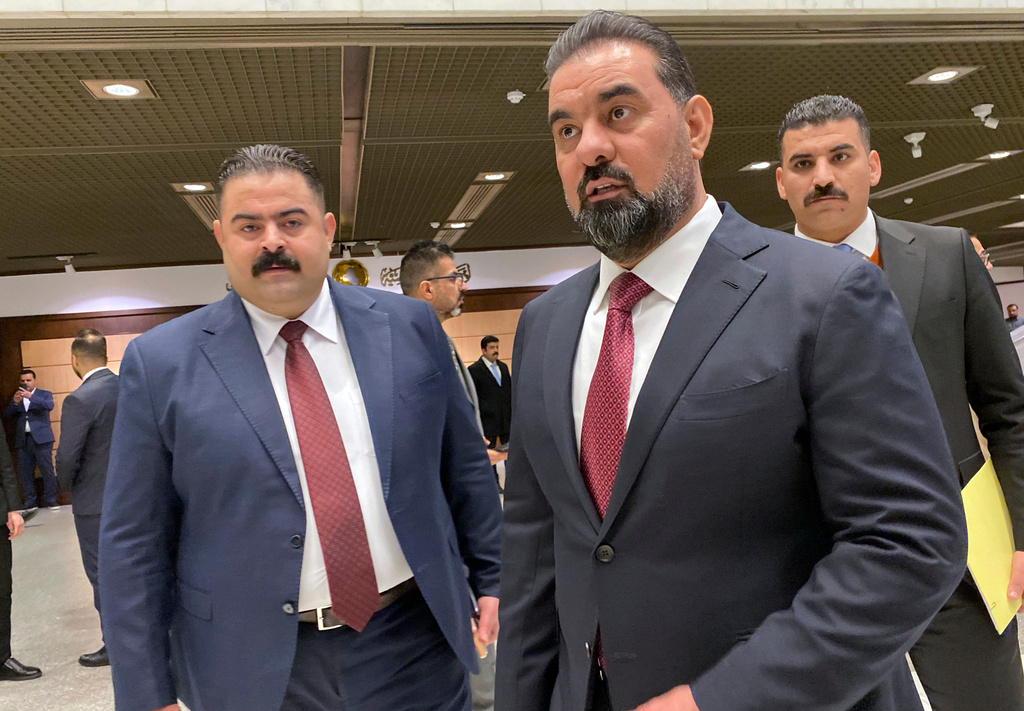 The new speaker of parliament Haibet Al-Halbousi, center, looks on before the start of their first legislative session in Baghdad, Iraq, Monday, Dec. 29, 2025. (AP Photo/Hadi Mizban)