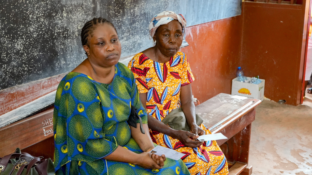 Women wait to cast their votes at a polling station in Libreville, Gabon, Saturday, Sept. 27, 2025. (AP Photo/Betines Makosso)