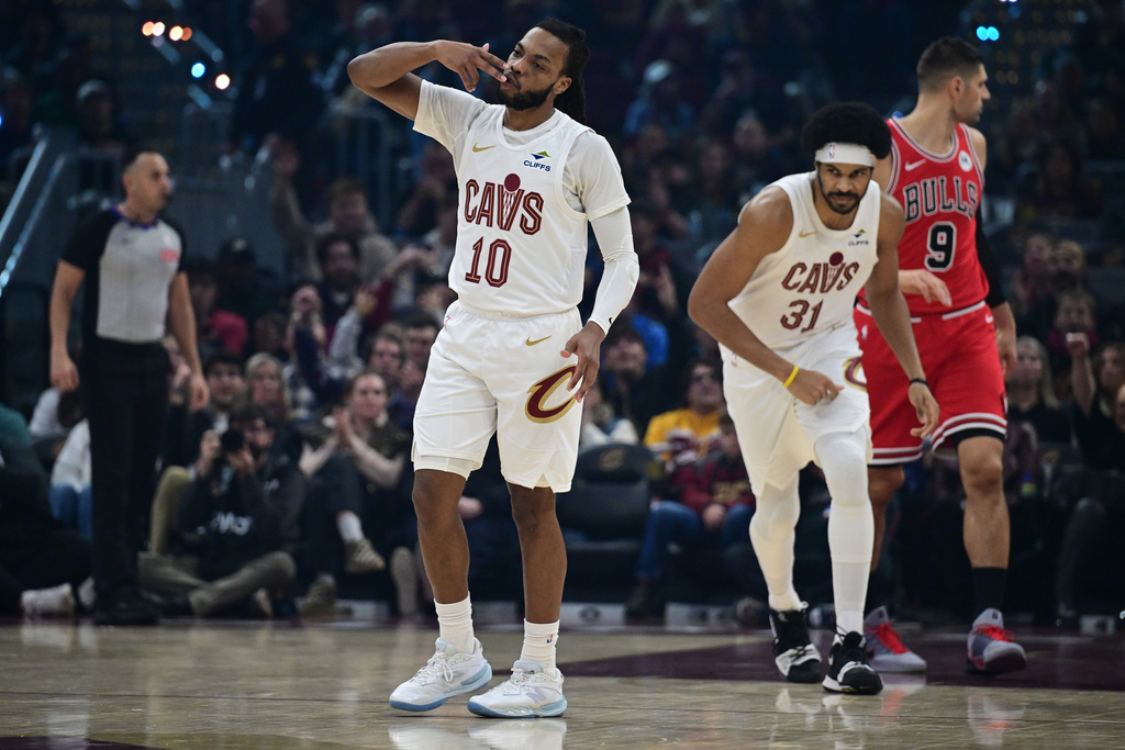 Cleveland Cavaliers guard Darius Garland celebrates after making a three-point basket in the first half of an NBA basketball game against the Chicago Bulls, Friday, Dec. 19, 2025, in Cleveland. (AP Photo/David Dermer)