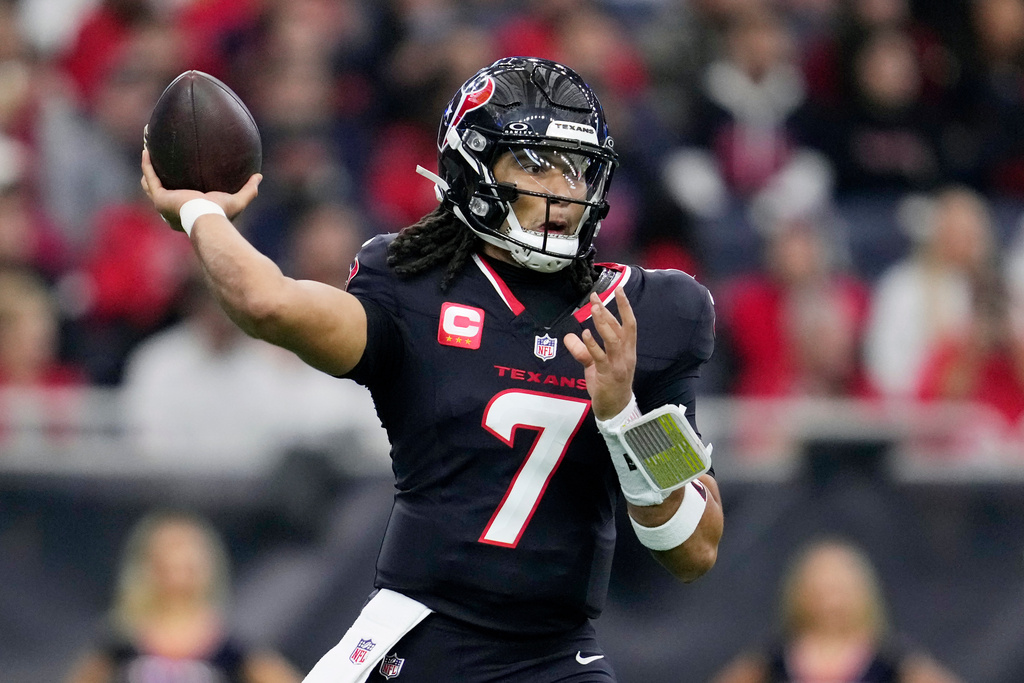 Houston Texans quarterback C.J. Stroud throws against the Arizona Cardinals during the first half of an NFL football game Sunday, Dec. 14, 2025, in Houston. (AP Photo/Ashley Landis)