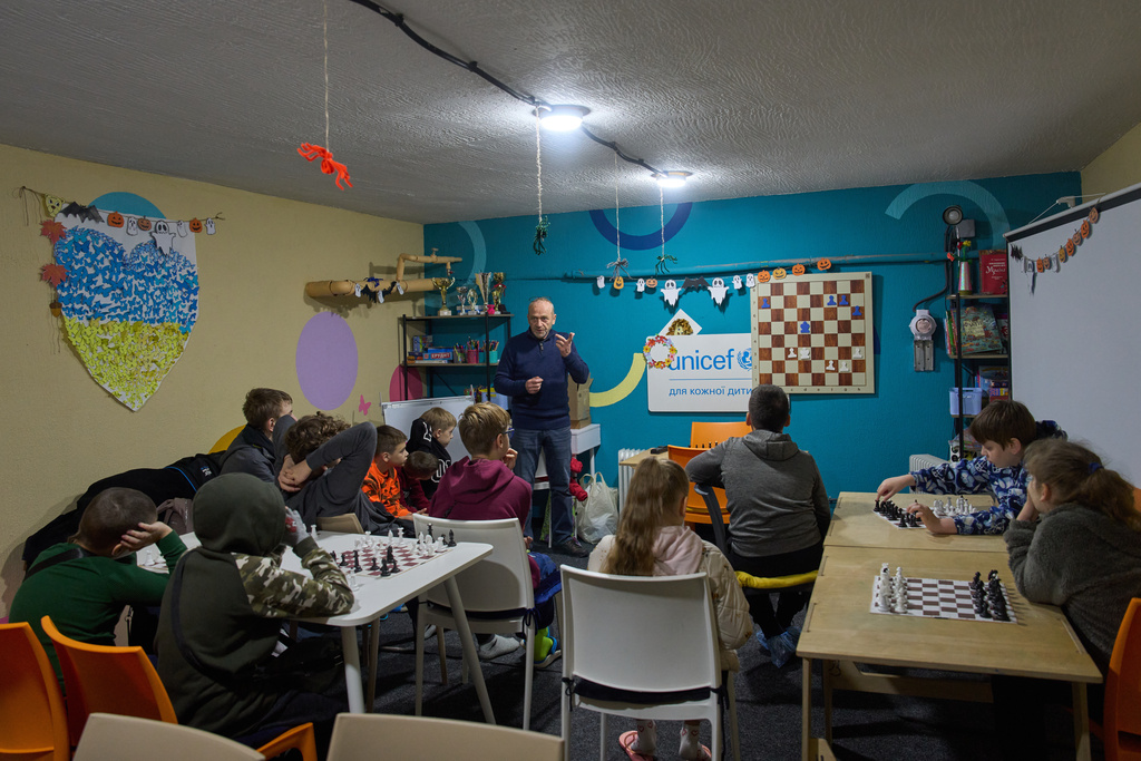 Children study chess in an underground shelter in the frontline city of Kherson, Southern Ukraine, Nov. 2, 2025. (AP Photo/Efrem Lukatsky)
