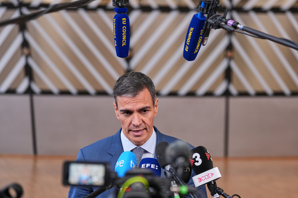 Spain's Prime Minister Pedro Sanchez talks to journalists as he arrives for the EU summit in Brussels, Thursday, June 18, 2026. (AP Photo/Marius Burgelman)