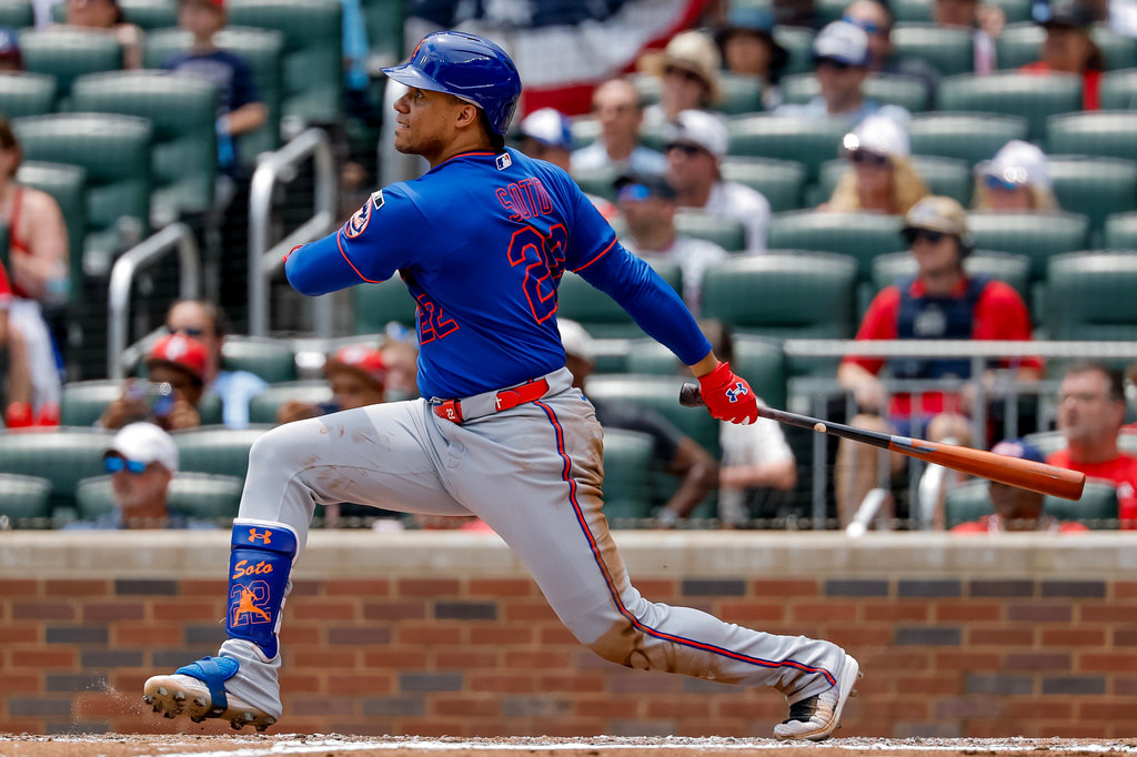New York Mets designated hitter Juan Soto watches his two-run single against the Atlanta Braves during the second inning of a baseball game, Sunday, July 5, 2026, in Atlanta. (AP Photo/Erik S. Lesser)