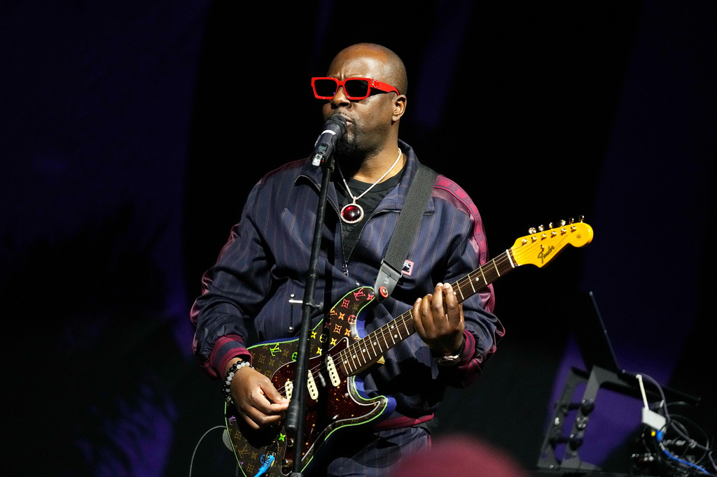 FILE - Singer and activist Wyclef Jean performs after a WNBA basketball game between the Phoenix Mercury and the Chicago Sky on May 21, 2023, in Phoenix. (AP Photo/Ross D. Franklin, file)