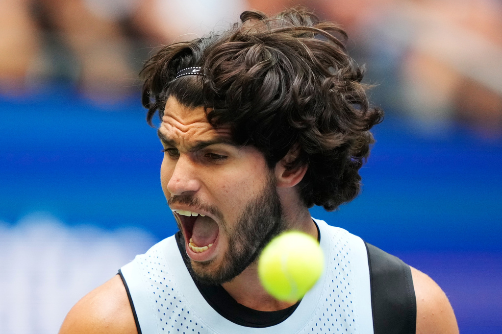 Carlos Alcaraz, of Spain, reacts during the fourth round of the U.S. Open tennis championships against Tommy Paul, of the United States, Sunday, Sept. 6, 2026, in New York. (AP Photo/Yuki Iwamura)