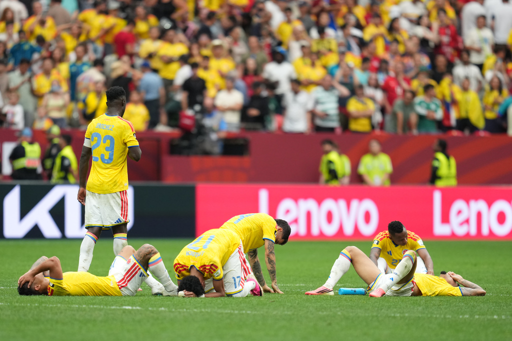 Colombian players lie dejected after losing penalty shootout during the World Cup round of 16 soccer match between Switzerland and Colombia in Vancouver, British Columbia, Tuesday, July 7, 2026. (AP Photo/Abbie Parr)