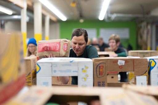 A volunteer sorts items for distribution at the Oregon Food Bank in Portland, Ore., Wednesday, Oct. 29, 2025. (AP Photo/Jenny Kane) A volunteer sorts items for distribution at the Oregon Food Bank in Portland, Ore., Wednesday, Oct. 29, 2025. (AP Photo/Jenny Kane)