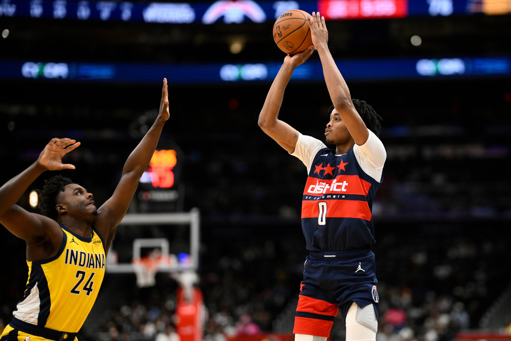 Washington Wizards guard Bilal Coulibaly (0) looks to shoot against Indiana Pacers guard Kobe Brown (24) during the second half of an NBA basketball game, Friday, Feb. 20, 2026, in Washington. (AP Photo/Nick Wass)