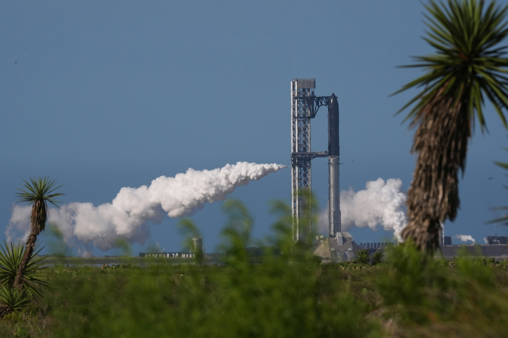 SpaceX's mega rocket Starship is prepared for a test flight that was later delayed in Starbase, Texas, Thursday, May 21, 2026. (AP Photo/Eric Gay)