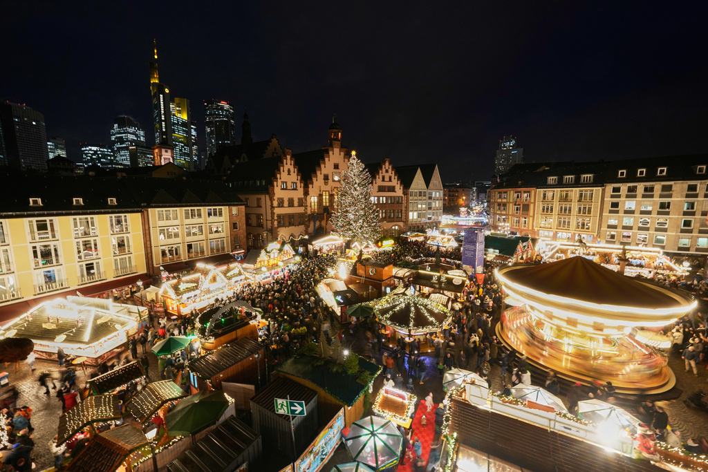 Lights illuminate the traditional Christmas Market in Frankfurt, Germany, Monday, Nov. 24, 2025. (AP Photo/Michael Probst)