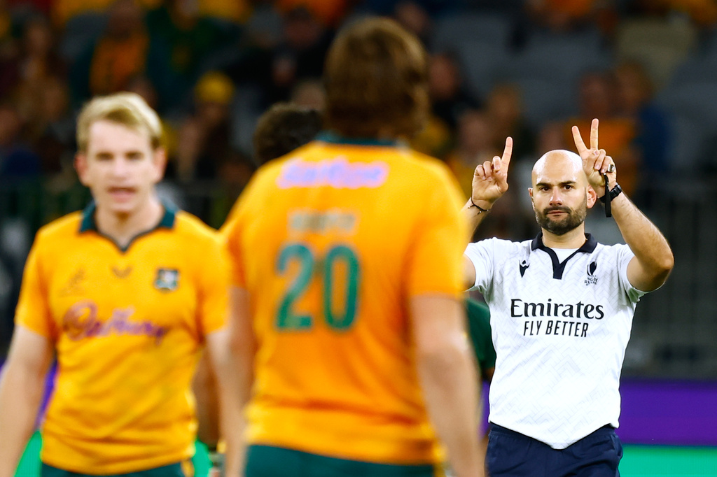 Referee Andrea Piardi gestures for Australia's Hunter Paisami to come forward to administer a yellow card during their rugby union test match against South Africa in Perth, Australia, on Sunday, Sept. 27, 2026. (AP Photo/Gary Day)