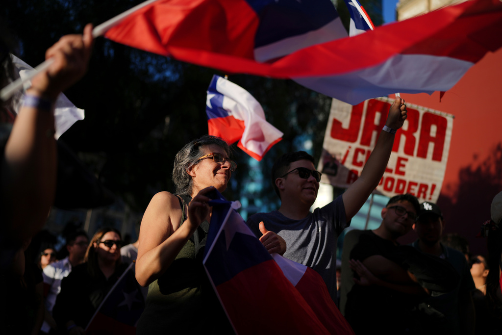 Supporters of presidential candidate Jeannette Jara of the Unidad por Chile coalition react to early results in the general elections in Santiago, Chile, Sunday, Nov. 16, 2025. (AP Photo/Natacha Pisarenko)